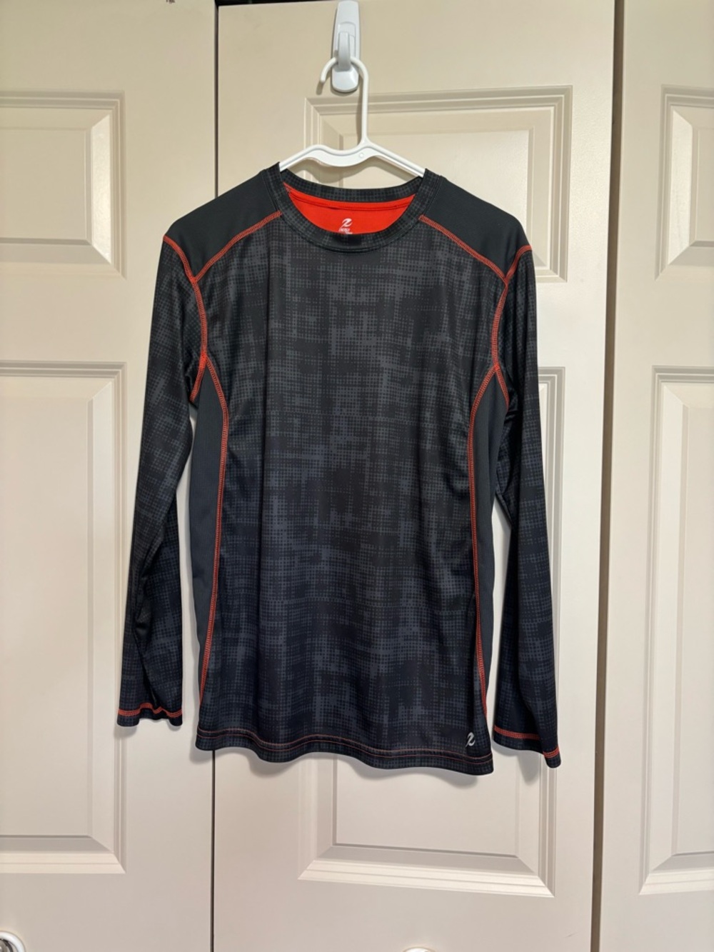Energy Zone Black Athletic Top with Orange accents.
